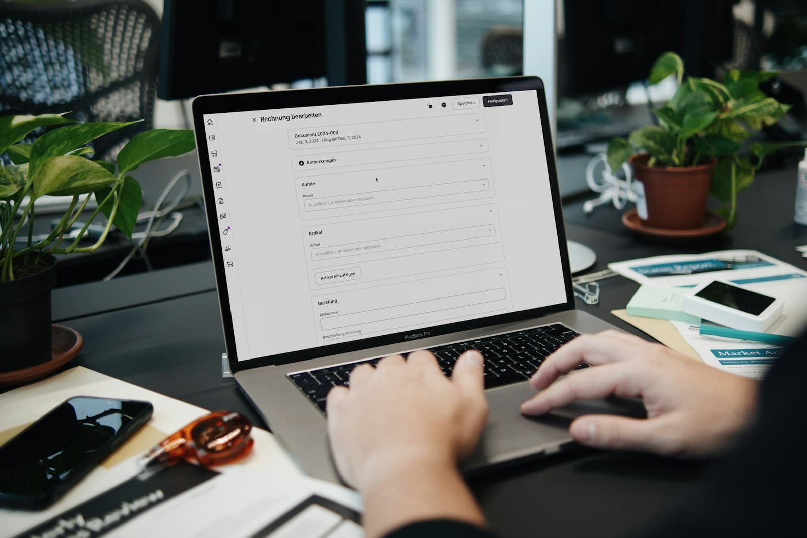 Professional working on a laptop at an organized desk