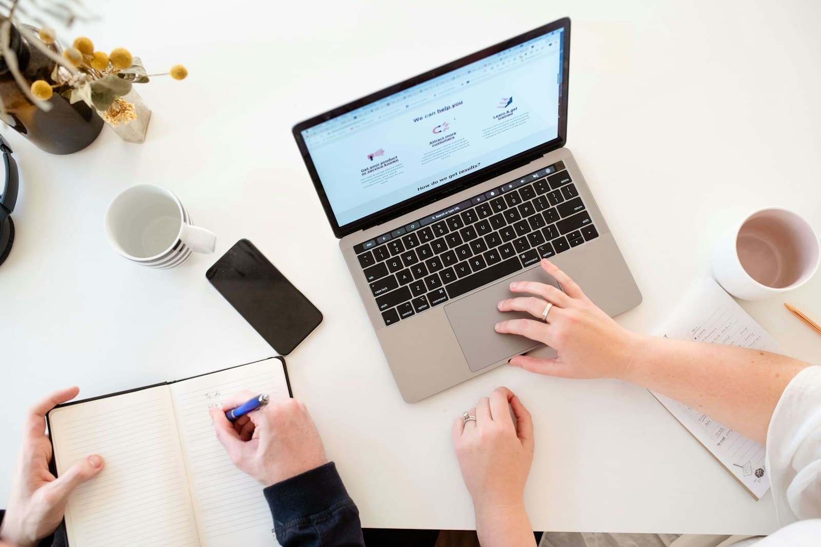 Professional composing a follow-up message at a laptop